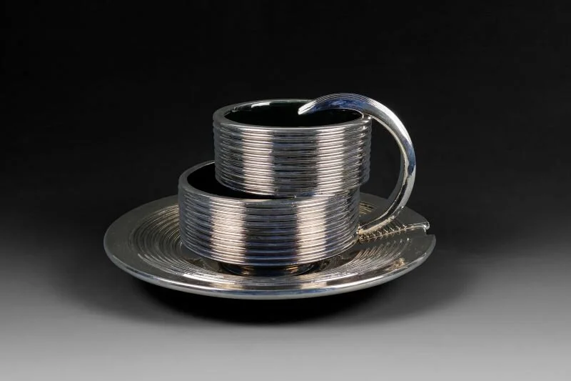 “Displaced Cup, Saucer,” 2021, Platinum Luster Glaze, Earthenware - 4.5 x 8 x 8in. (11.4 x 20.3 x 20.3cm)