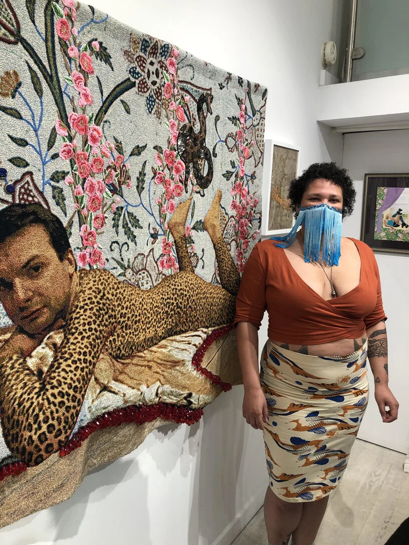 Katie Commodore at the opening reception for her solo show Between Friends and Lovers at Untitled Space - standing with her work “Greg in His Catsuit,” 2018